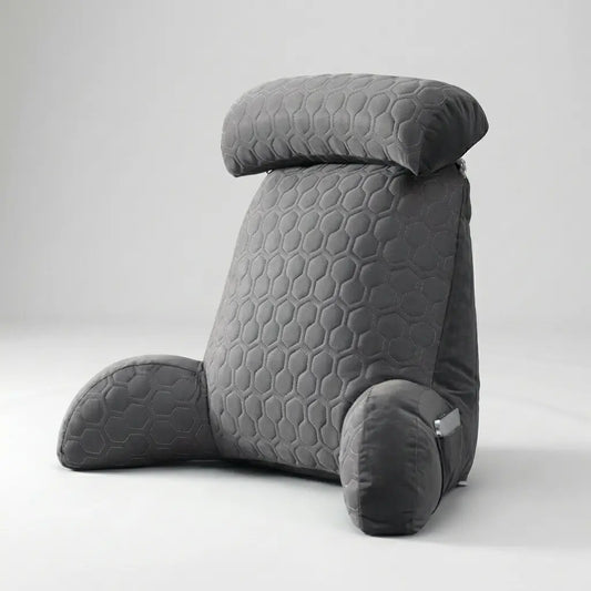 Coussin de lecture Confort Pro en velours gris sur un lit, vue de face
