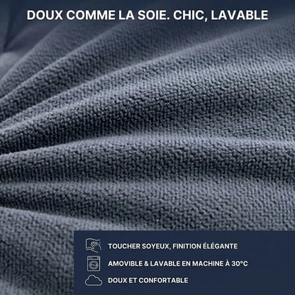 Gros plan sur la finition en polyester soyeux et élégant du coussin tête de lit de luxe avec housse amovible et lavable.