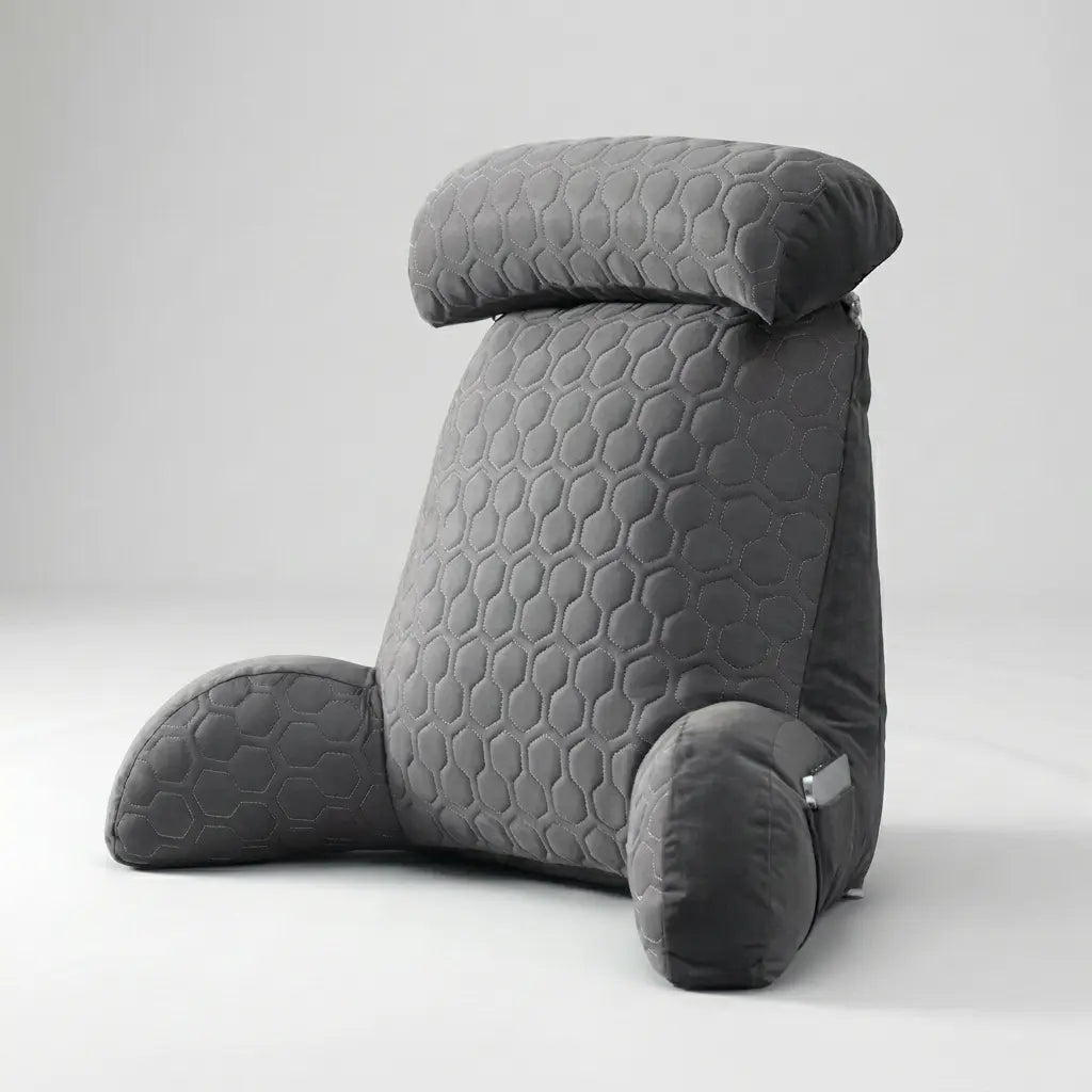 Coussin de lecture Confort Pro en velours gris sur un lit, vue de face