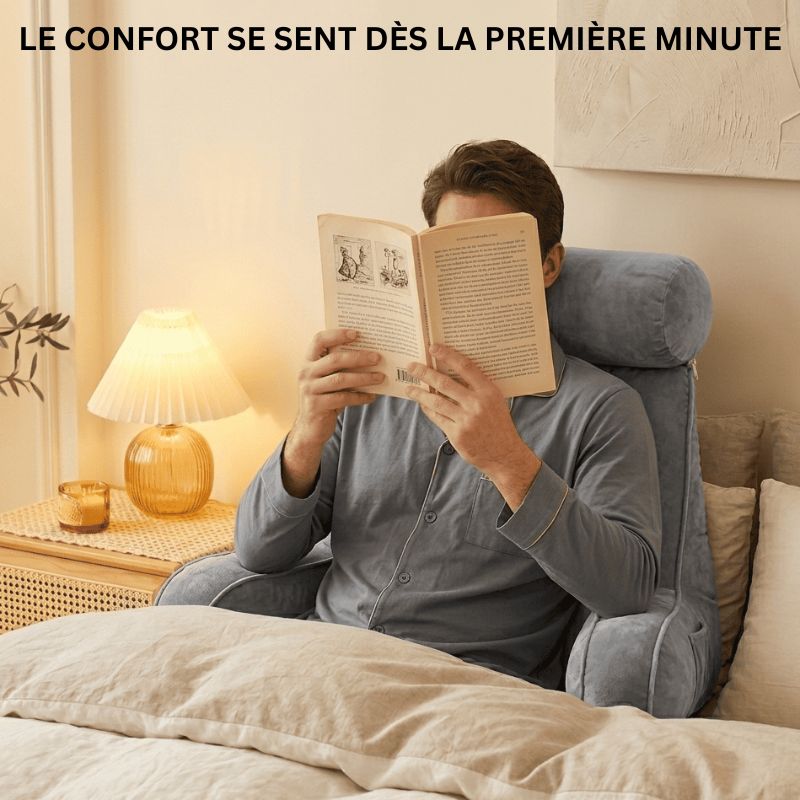 Homme lisant dans son lit avec le coussin de lecture Confort Nerua