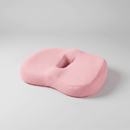 Coussin pour chaise de bureau ergonomique mémoire de forme rose fond gris