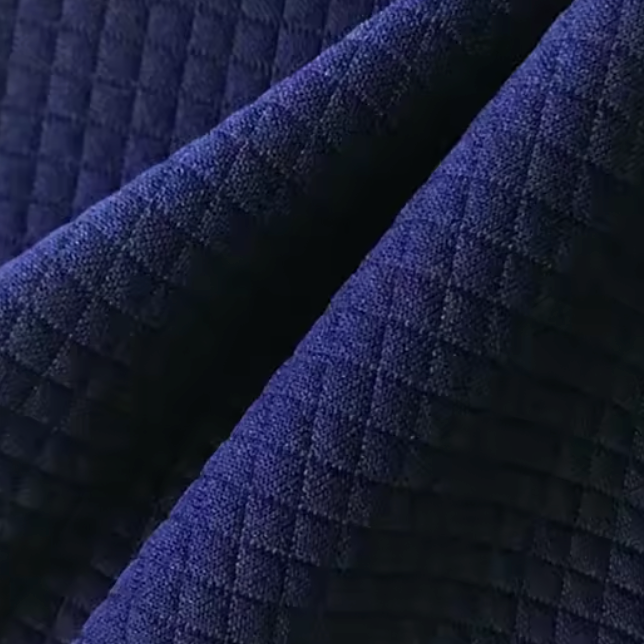 Zoom gros plan sur la housse lavable du coussin de siège ergonomique lavable.