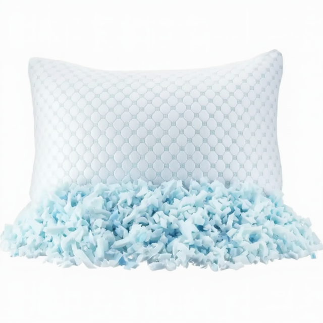 Oreiller ajustable et plusieurs mousses à mémoire de forme déchiquetées posée à côté.